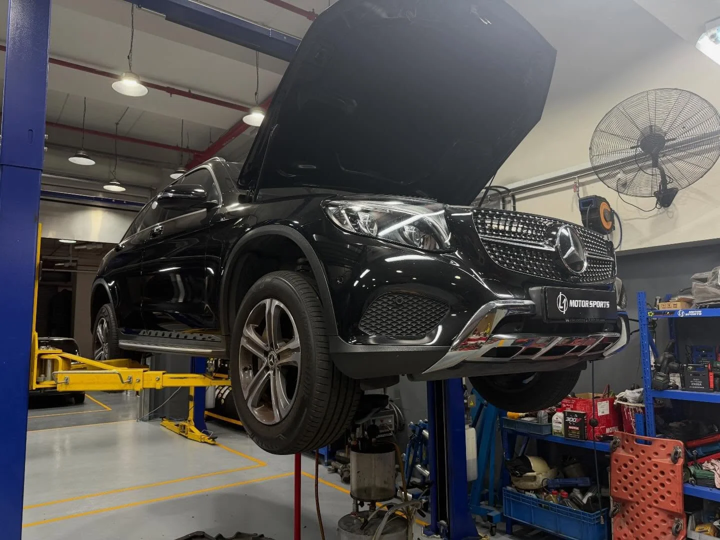 Full undercarriage inspection on the lift at L1 Motorsports